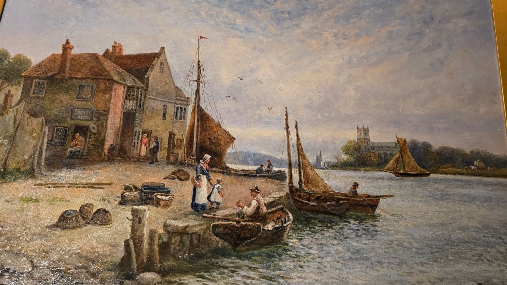 An antique oil painting depicting a coastal harbour scene with boats and figures, set within an ornate carved gold frame. View VII