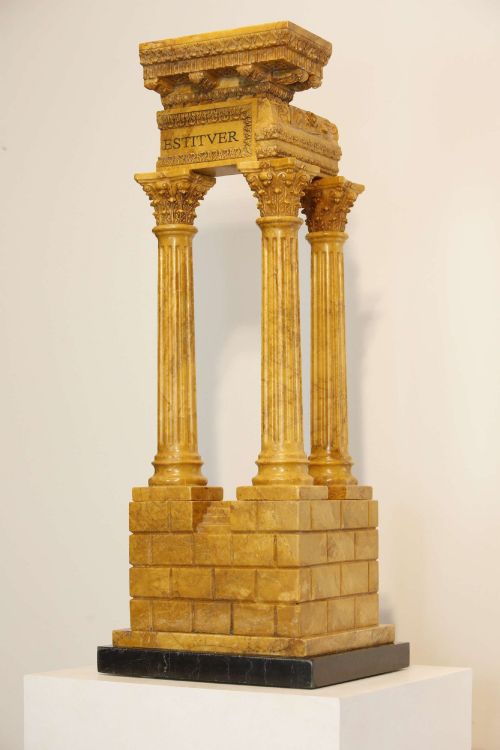 fig 1. A 19th-century Grand Tour sienna marble architectural model depicting three fluted Corinthian columns of the Temple of Vespasian mounted on a black marble base.