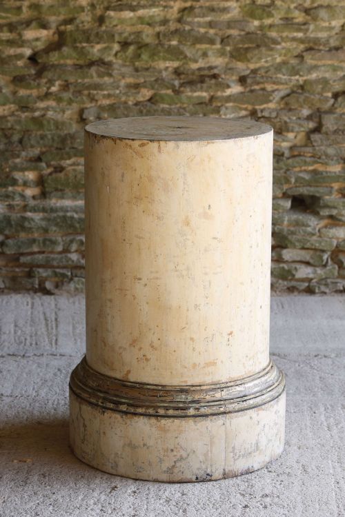 fig 1. A cylindrical 18th-century Neoclassical painted pine column pedestal with a stepped moulded base and a weathered cream paint finish.