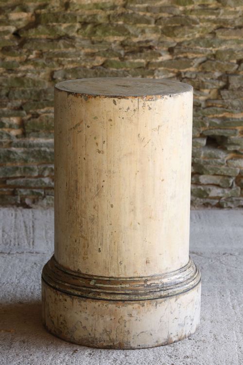 fig 2. A cylindrical 18th-century Neoclassical painted pine column pedestal with a stepped moulded base and a weathered cream paint finish.