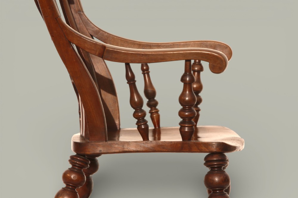 A late 19th-century Victorian Windsor armchair made from fruitwood and elm with a pierced back splat, turned legs, and a shaped seat. View VIII