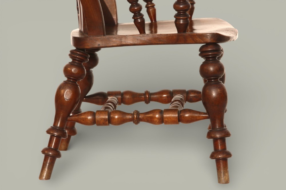 A late 19th-century Victorian Windsor armchair made from fruitwood and elm with a pierced back splat, turned legs, and a shaped seat. View IX