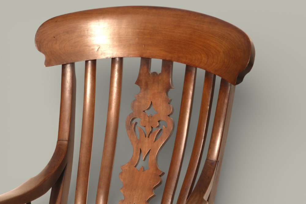 A late 19th-century Victorian Windsor armchair made from fruitwood and elm with a pierced back splat, turned legs, and a shaped seat. View XII