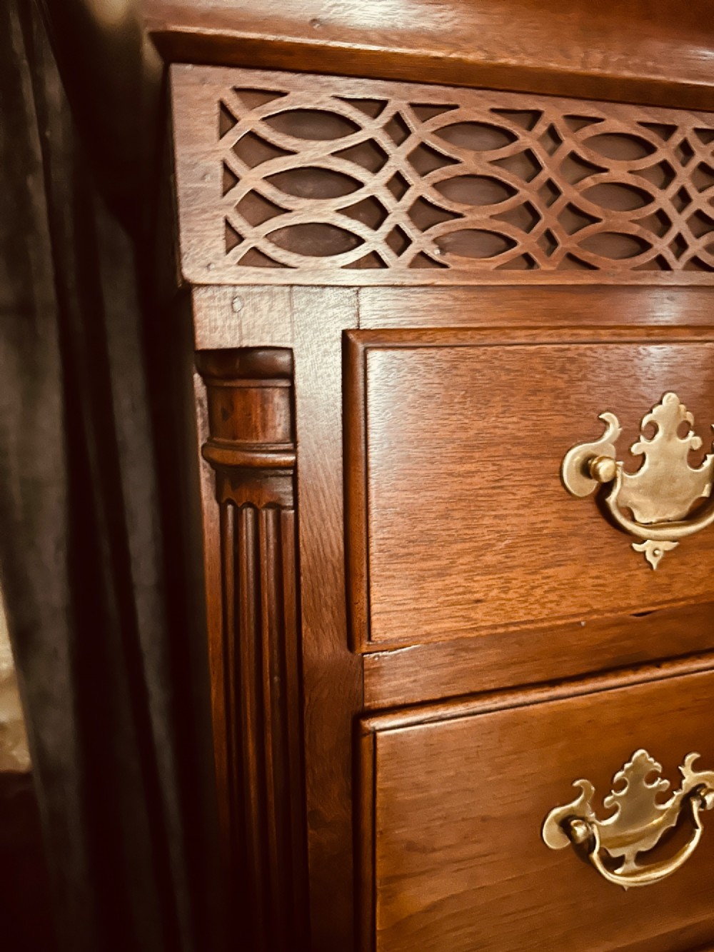 A tall Victorian walnut chest of drawers featuring three upper small drawers above five graduated full-width drawers with ornate brass handles. View VI
