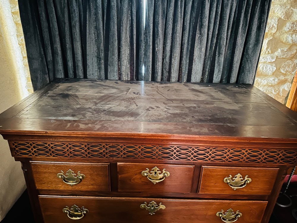A tall Victorian walnut chest of drawers featuring three upper small drawers above five graduated full-width drawers with ornate brass handles. View IX