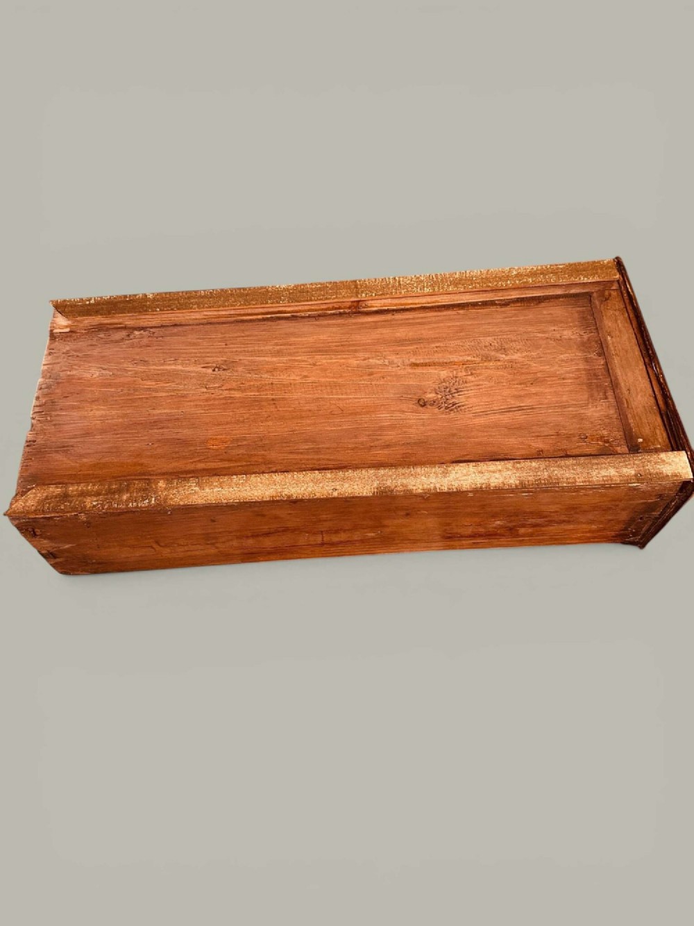 An antique Georgian kneehole bureau in warm brown burr oak featuring multiple small drawers, brass drop handles, a central cupboard, and a hinged top surface. View XV