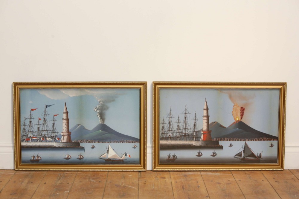 A pair of framed 19th-century gouache paintings depicting maritime scenes with sailing ships, a harbour lighthouse, and Mount Vesuvius in gilt frames. View II