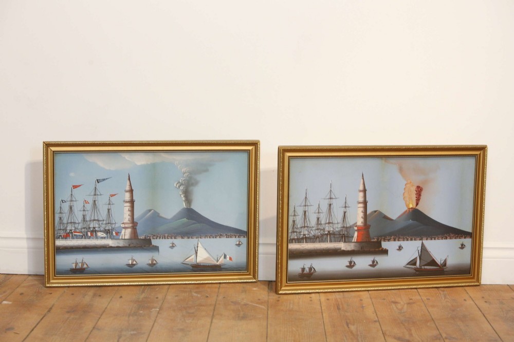 A pair of framed 19th-century gouache paintings depicting maritime scenes with sailing ships, a harbour lighthouse, and Mount Vesuvius in gilt frames. View III