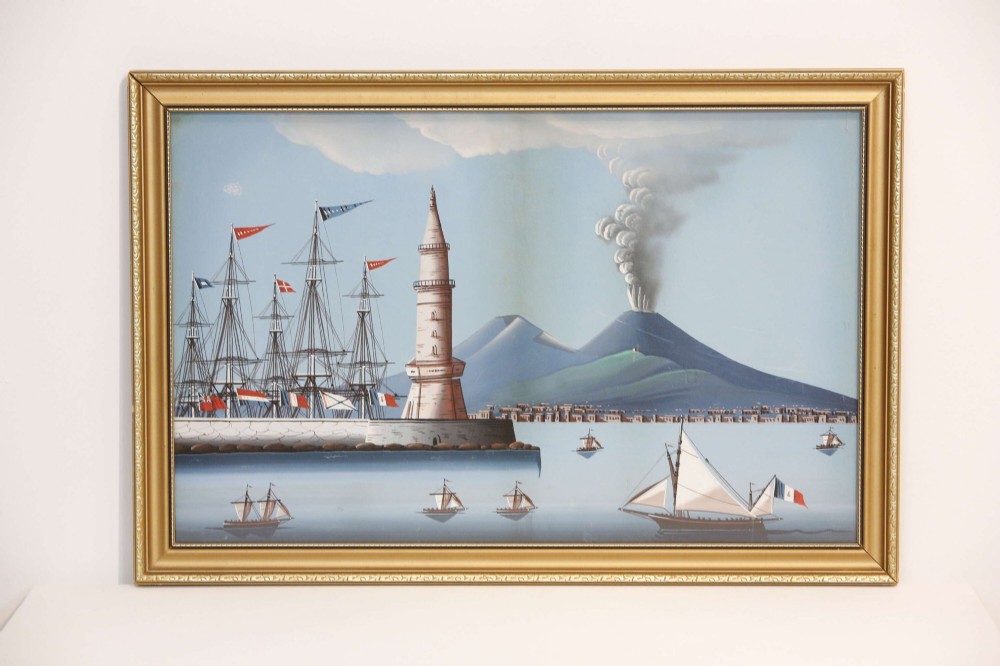 A pair of framed 19th-century gouache paintings depicting maritime scenes with sailing ships, a harbour lighthouse, and Mount Vesuvius in gilt frames. View XII
