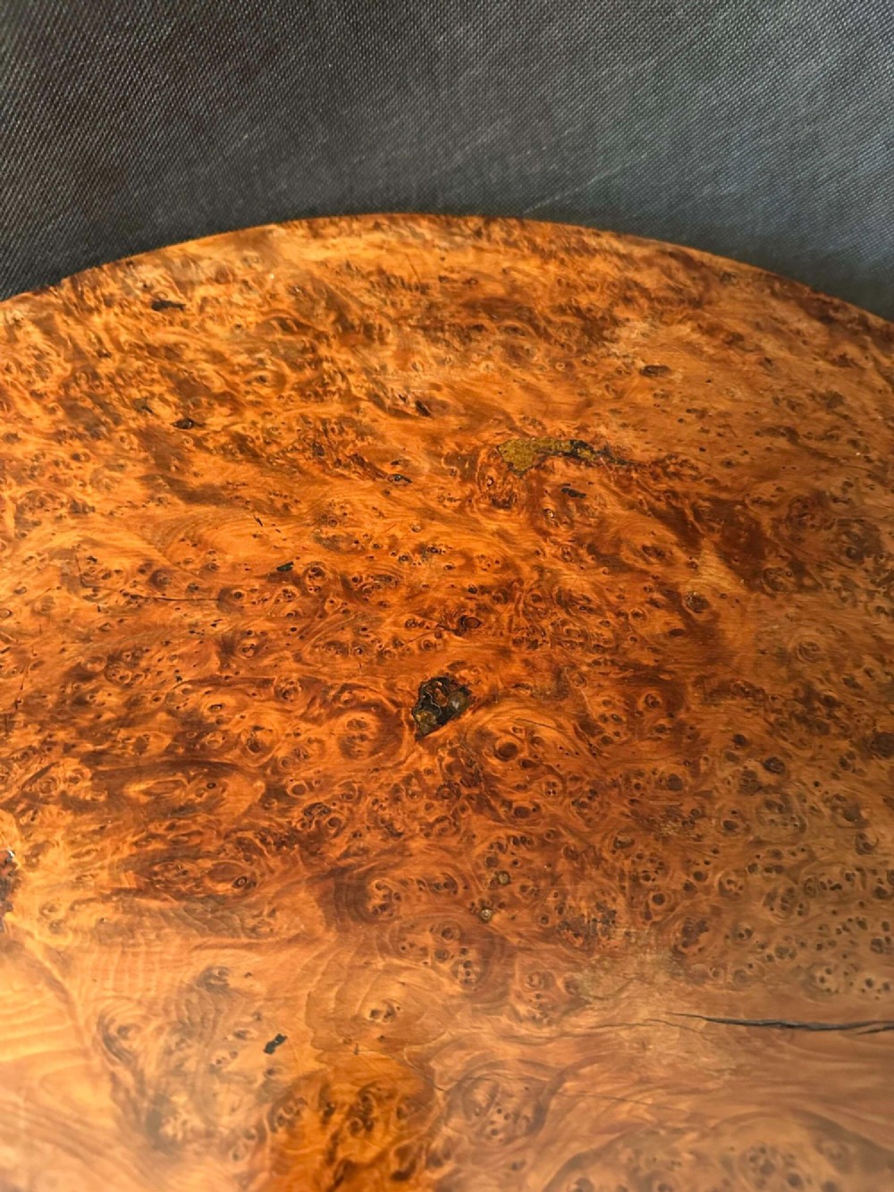 A Georgian circular occasional table crafted from burr yew wood featuring a turned central pedestal and a tripod base. View VI