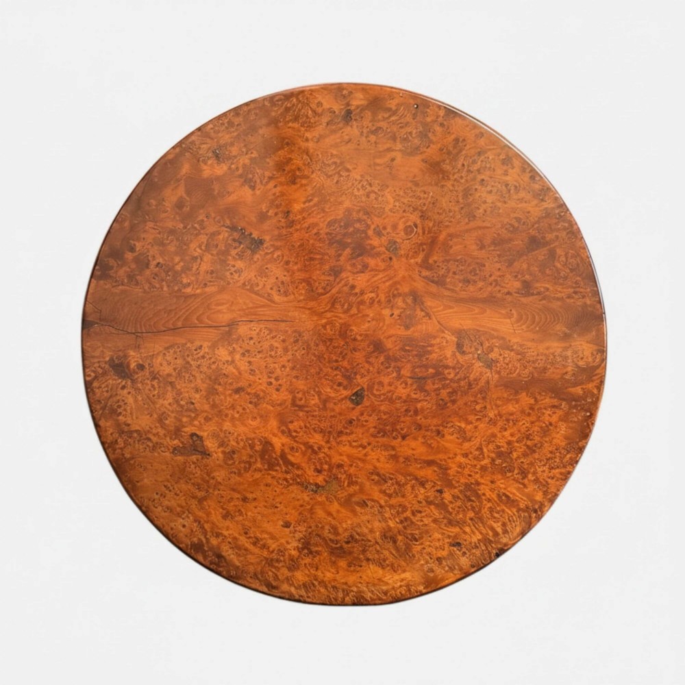 A Georgian circular occasional table crafted from burr yew wood featuring a turned central pedestal and a tripod base. View VIII