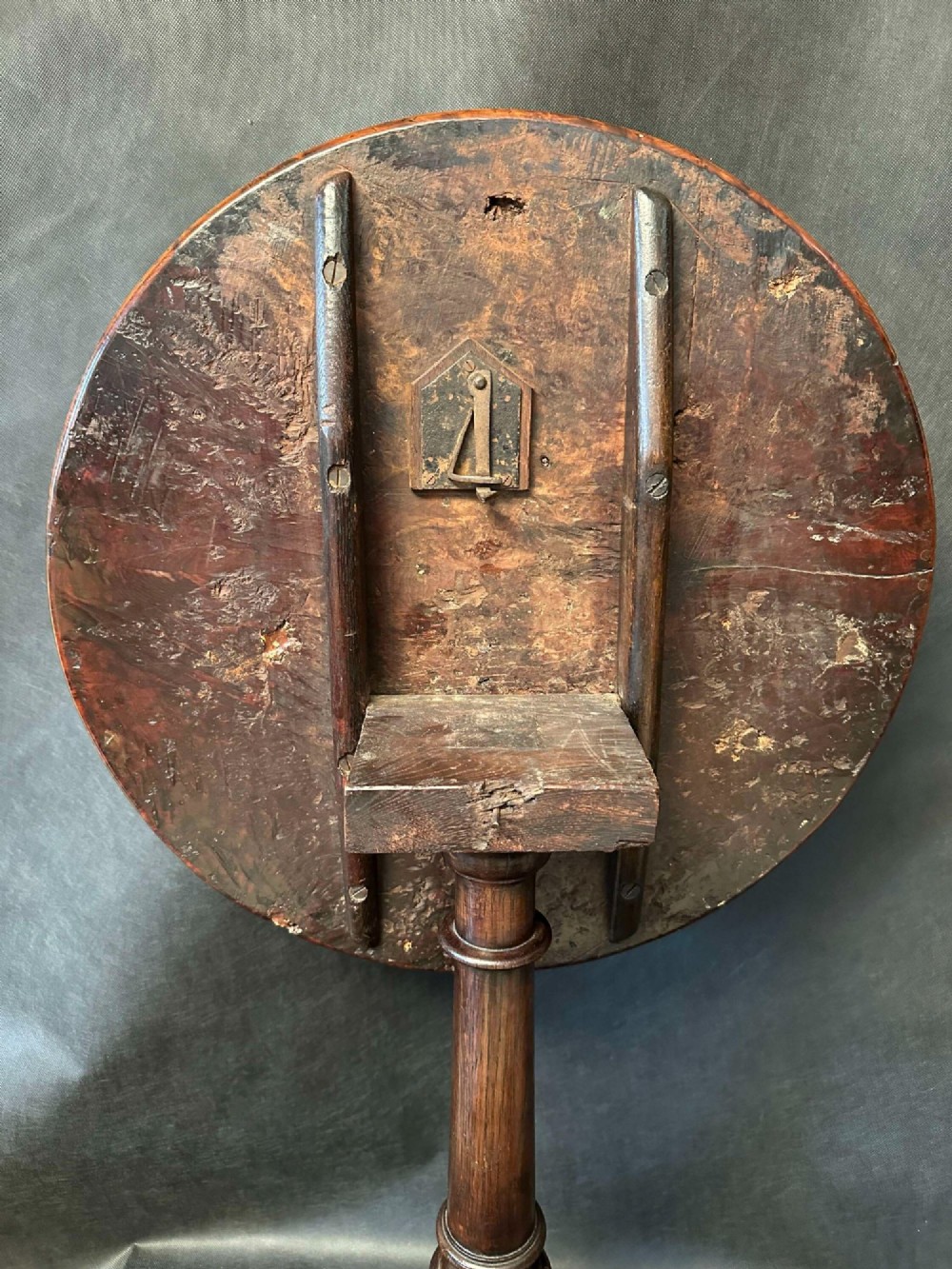 A Georgian circular occasional table crafted from burr yew wood featuring a turned central pedestal and a tripod base. View X