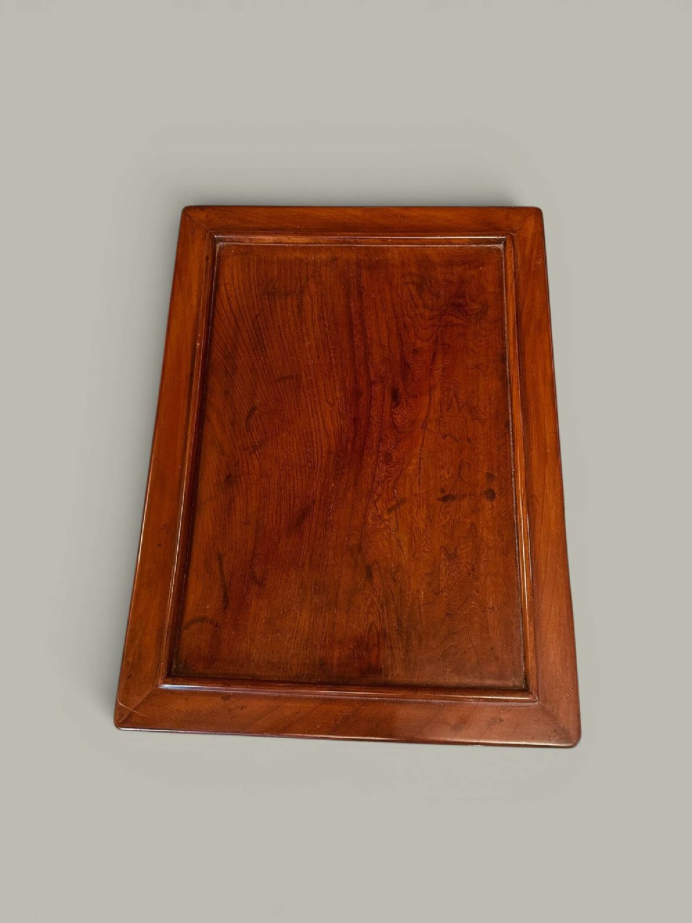 A pair of warm brown Chinese hardwood side tables featuring raised top borders, lower shelves, and straight square legs. View IV