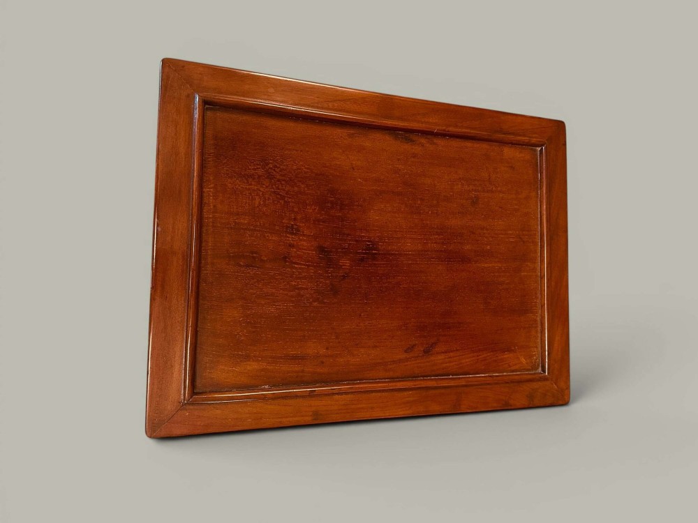A pair of warm brown Chinese hardwood side tables featuring raised top borders, lower shelves, and straight square legs. View V
