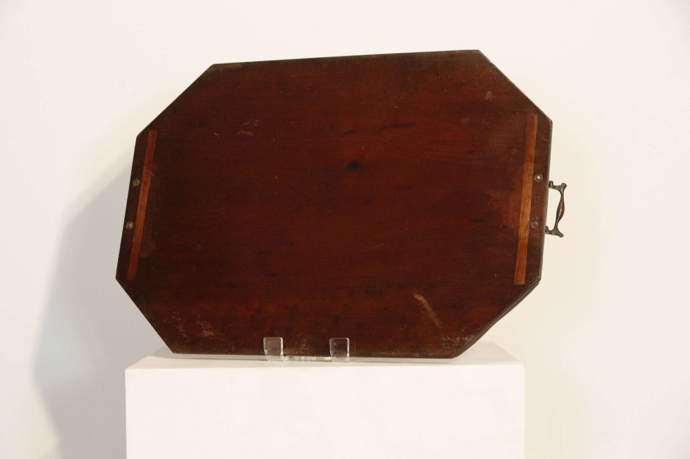 An octagonal mahogany serving tray featuring central marquetry inlay depicting twin winged griffins flanking a classical urn, with brass handles on two sides. View IX