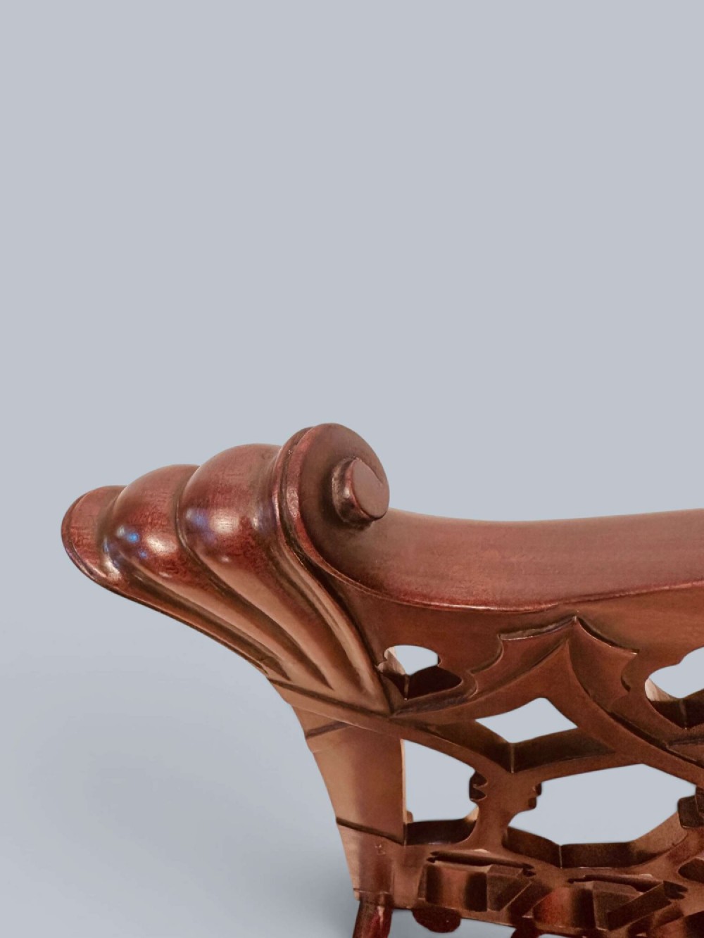 A pair of mahogany side chairs featuring pierced Gothic tracery backrests, straight square legs with H-stretchers, and patterned red fabric upholstery. View XI