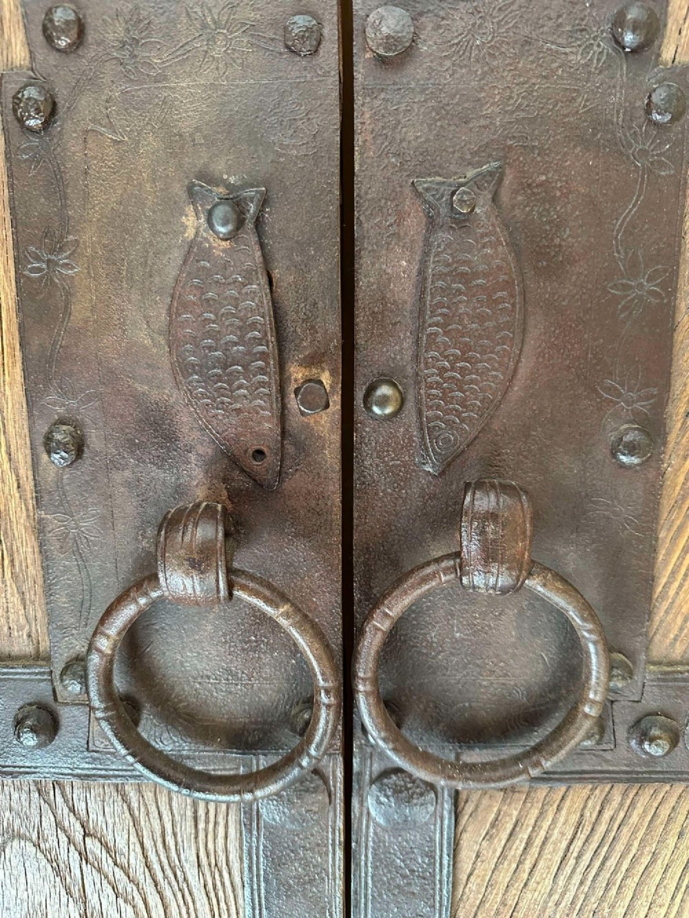 Pair of late nineteenth-century reclaimed Chinese elm doors featuring heavy iron strapping, metal studs, and central ring handles. View VI