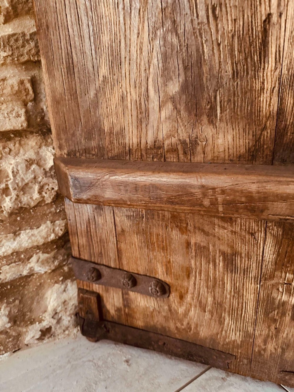 A pair of antique Chinese reclaimed locust wood doors with iron straps, decorative studs, and central ring handles. View XI