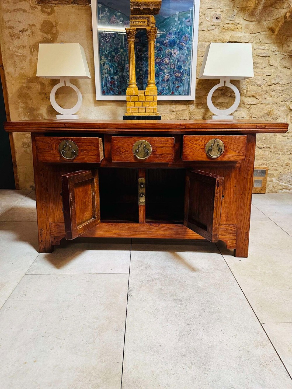 A warm brown Chinese elm altar cabinet featuring three upper drawers, two central cupboard doors, and round brass hardware. View IV
