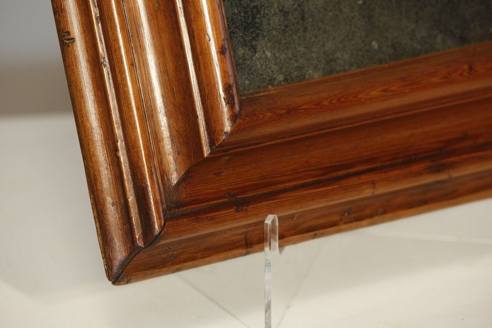 A pair of matching rectangular wall mirrors with deep moulded pine frames and distressed glass plates. View VII