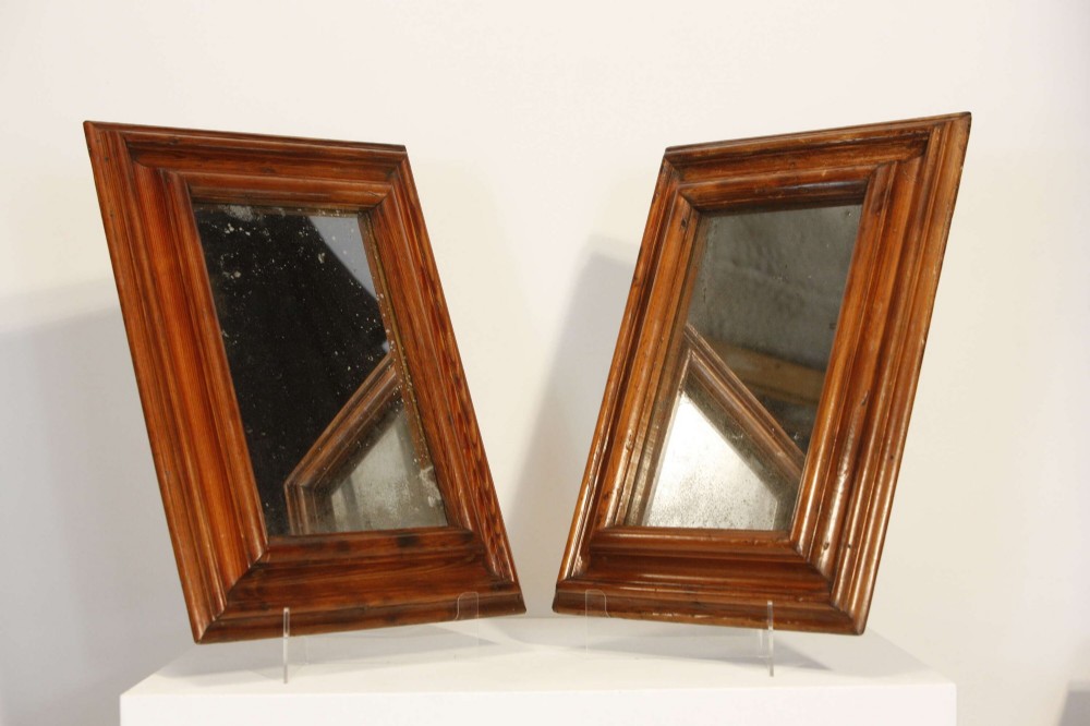 A pair of matching rectangular wall mirrors with deep moulded pine frames and distressed glass plates. View IX