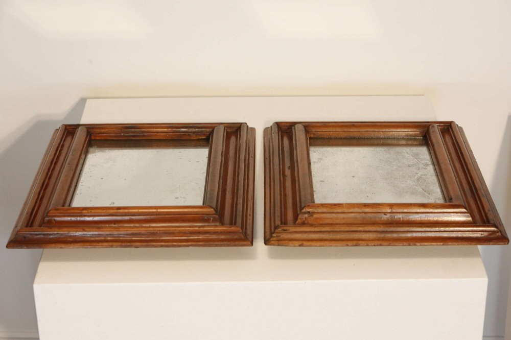 A pair of matching rectangular wall mirrors with deep moulded pine frames and distressed glass plates. View XIII
