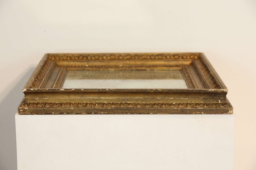 A 19th-century French rectangular giltwood wall mirror featuring a moulded frame with detailed borders and a heavily foxed glass plate. View XIII
