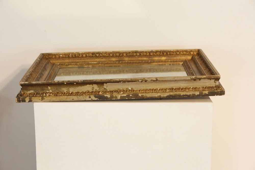 A 19th-century French rectangular giltwood wall mirror featuring a moulded frame with detailed borders and a heavily foxed glass plate. View XIV