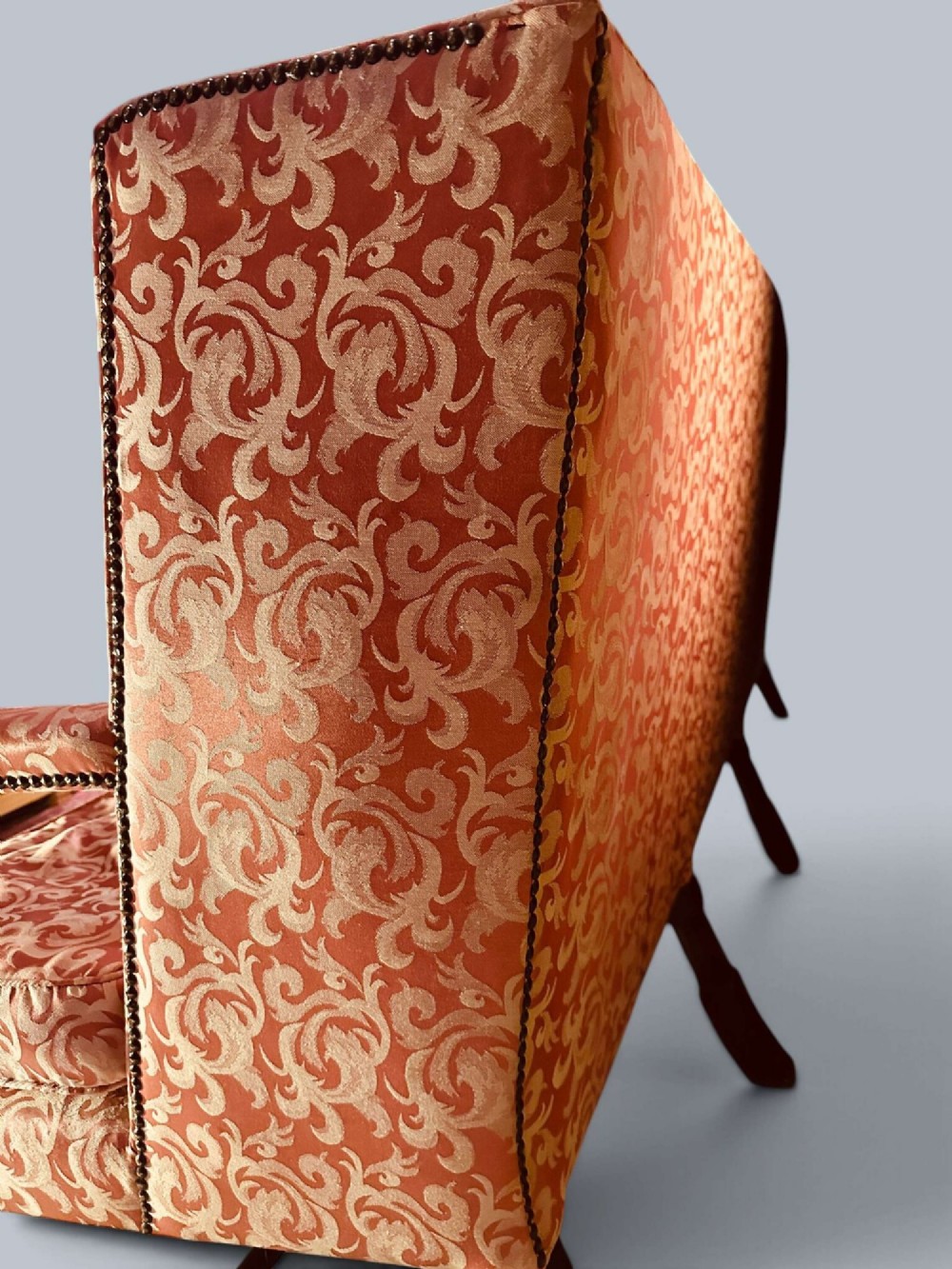 Late 19th-century Louis XIV style walnut sofa with intricately carved stretchers and red patterned damask fabric. View VI