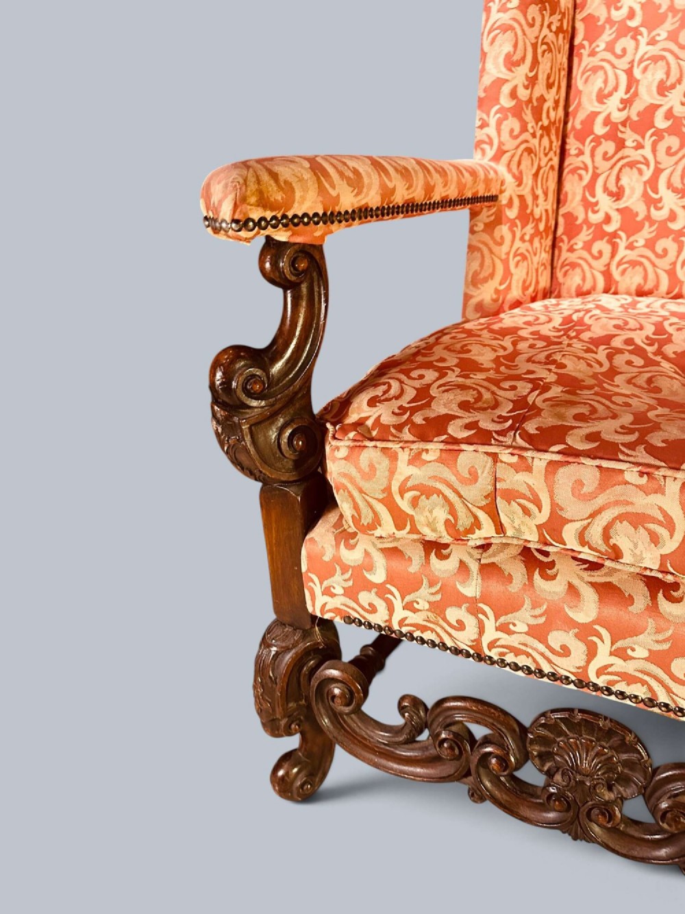 Late 19th-century Louis XIV style walnut sofa with intricately carved stretchers and red patterned damask fabric. View XI