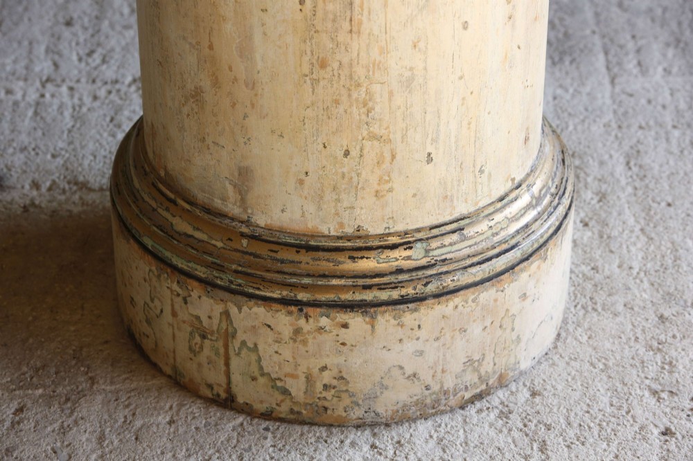 A cylindrical 18th-century Neoclassical painted pine column pedestal with a stepped moulded base and a weathered cream paint finish. View V