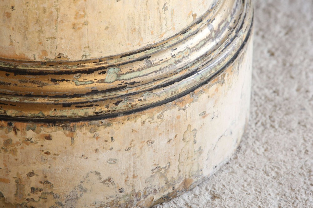 A cylindrical 18th-century Neoclassical painted pine column pedestal with a stepped moulded base and a weathered cream paint finish. View IX