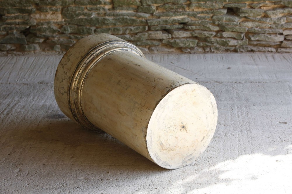 A cylindrical 18th-century Neoclassical painted pine column pedestal with a stepped moulded base and a weathered cream paint finish. View X