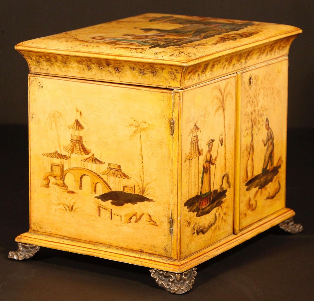 A yellow japanned Regency table cabinet decorated with hand-painted Chinoiserie figures and architecture, elevated on ornate metal feet. View VI