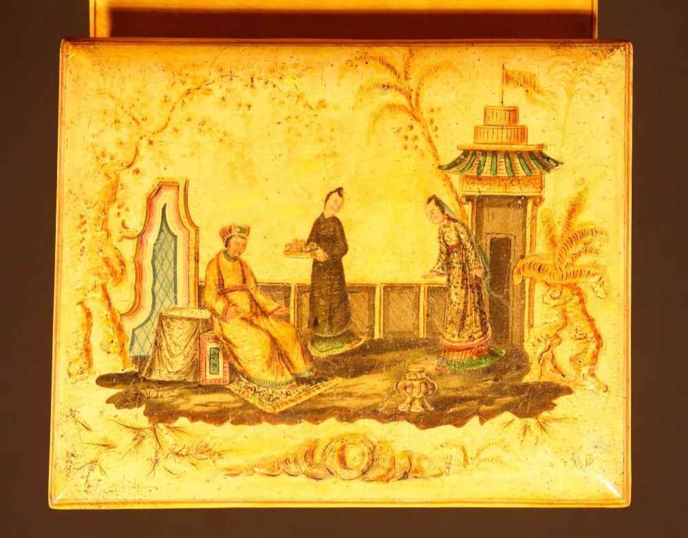 A yellow japanned Regency table cabinet decorated with hand-painted Chinoiserie figures and architecture, elevated on ornate metal feet. View IX