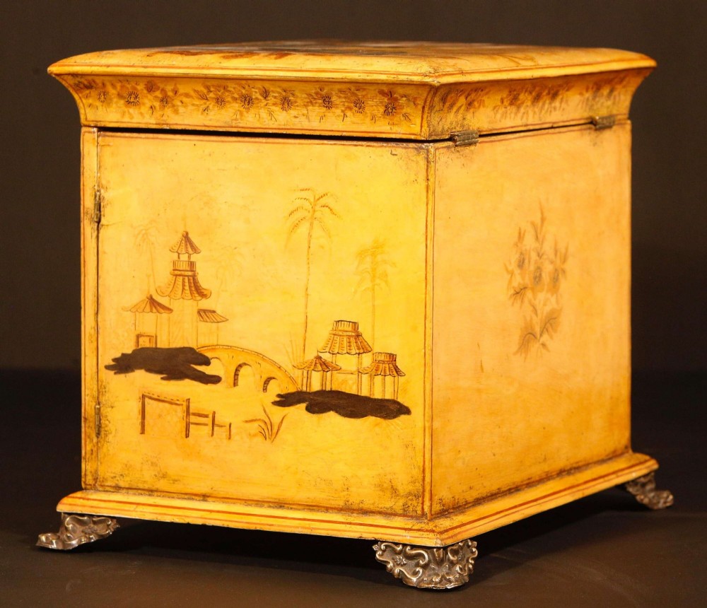 A yellow japanned Regency table cabinet decorated with hand-painted Chinoiserie figures and architecture, elevated on ornate metal feet. View XII