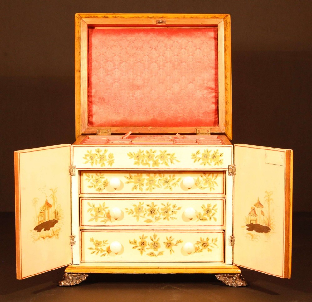 A yellow japanned Regency table cabinet decorated with hand-painted Chinoiserie figures and architecture, elevated on ornate metal feet. View XIII
