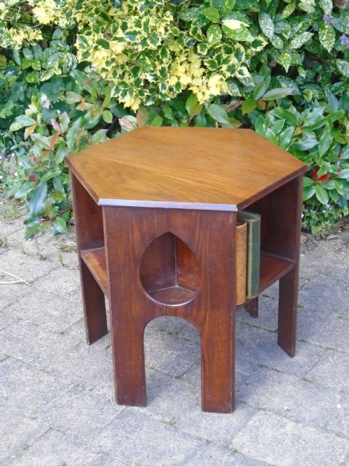 Arts & Crafts oak book  table with teardrops