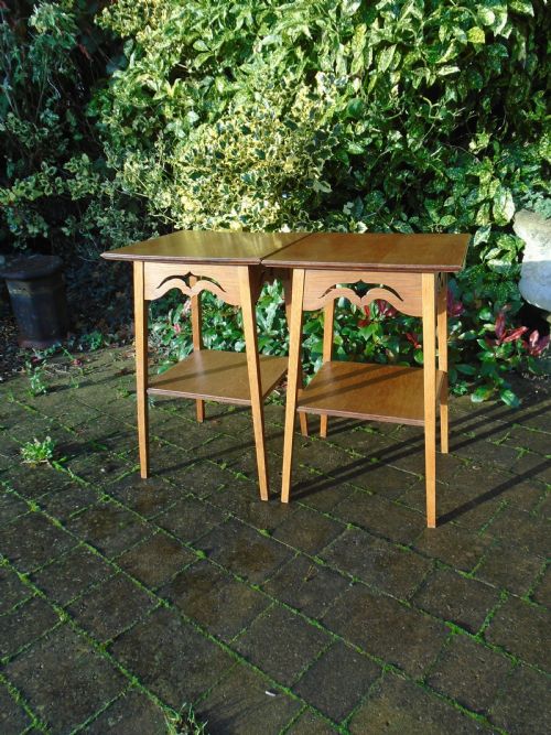 Pair of Arts & Crafts oak tables with pierced aprons