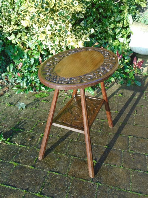 Beautifully carved oval Arts & Crafts oak table