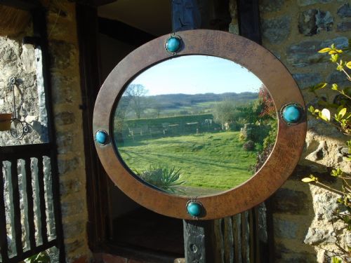 Arts & Crafts oval copper mirror for Liberty