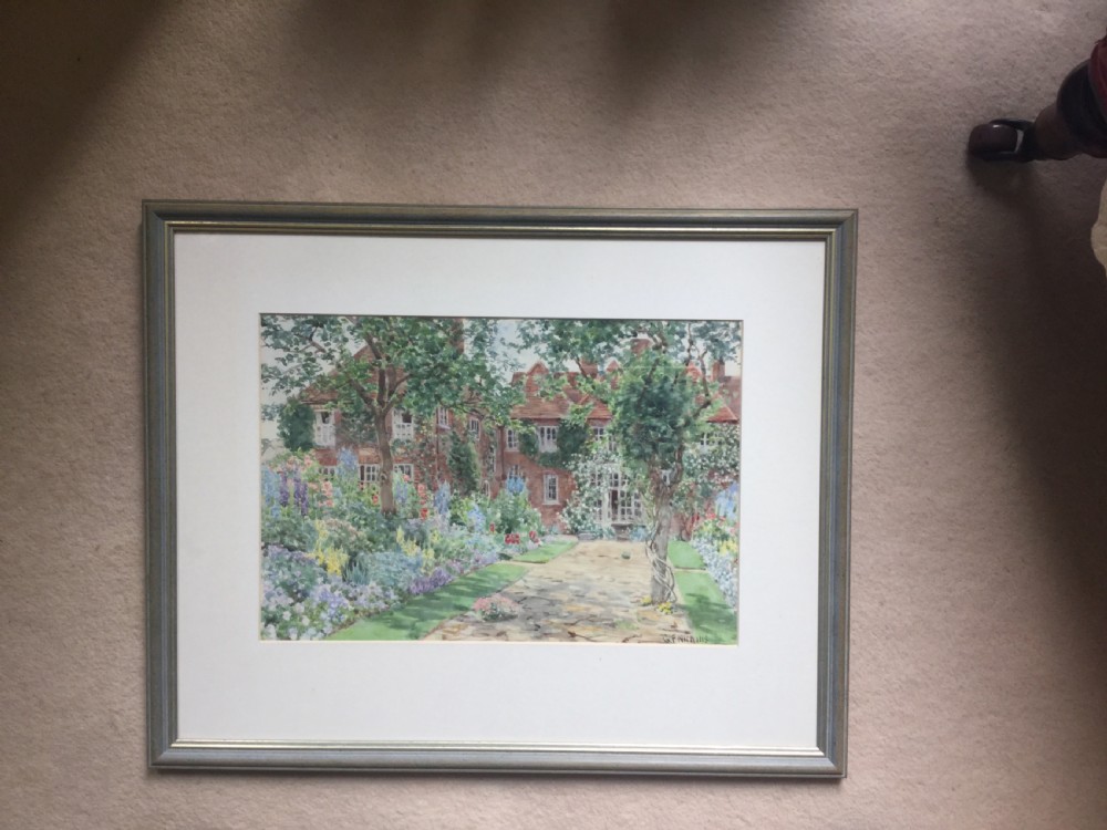 A watercolour painting depicting a red brick English country house behind a stone path flanked by vibrant summer flower beds. View III