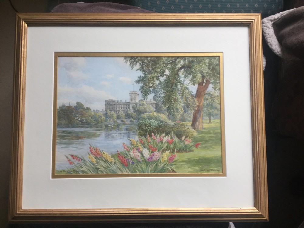 A watercolour painting depicting a bed of colourful flowers and green lawns alongside the lake in St James Park, London, with the Foreign Office building visible in the background. View II