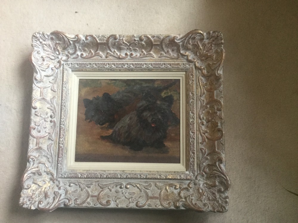 An oil painting on canvas depicting two dark Scottish Terriers resting together, displayed within a cream-painted wooden frame. View III
