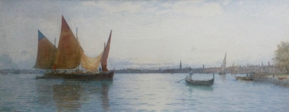 A horizontal watercolour painting depicting traditional sailing boats with terracotta and ochre sails on the Venetian lagoon with a distant skyline.