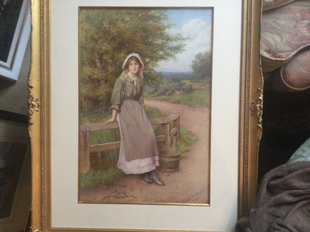 A Victorian watercolour painting depicting a young woman in a bonnet and apron leaning against a wooden fence by a country lane. View III