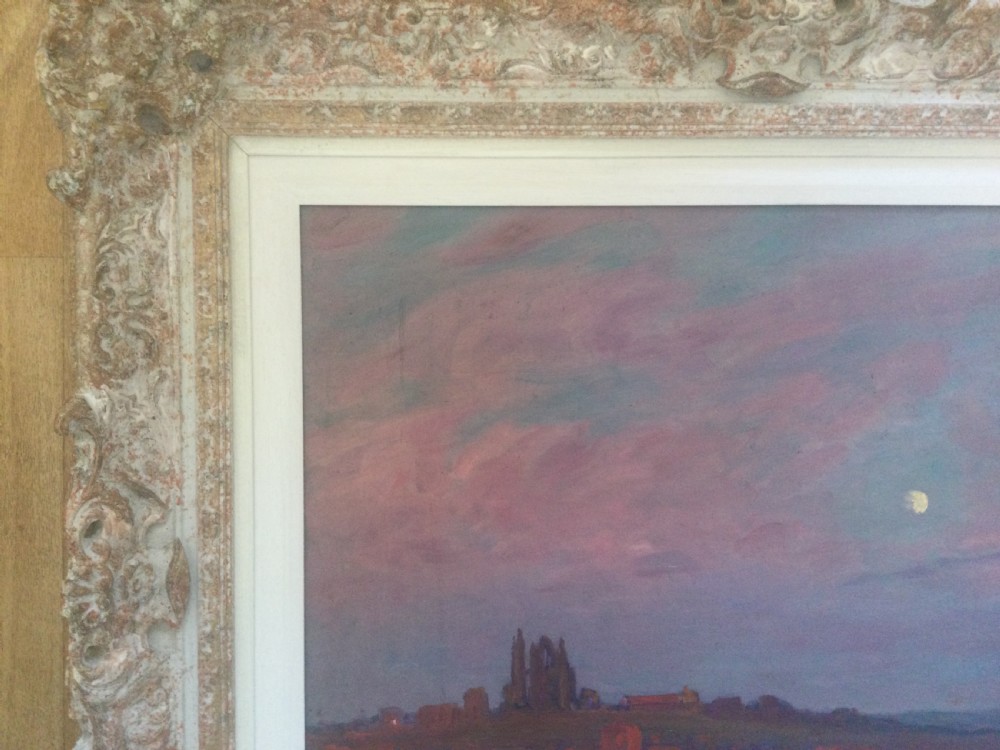 An impressionist oil painting depicting Whitby Abbey silhouetted against a twilight sky in shades of purple and pink, presented in an ornate carved frame. View V