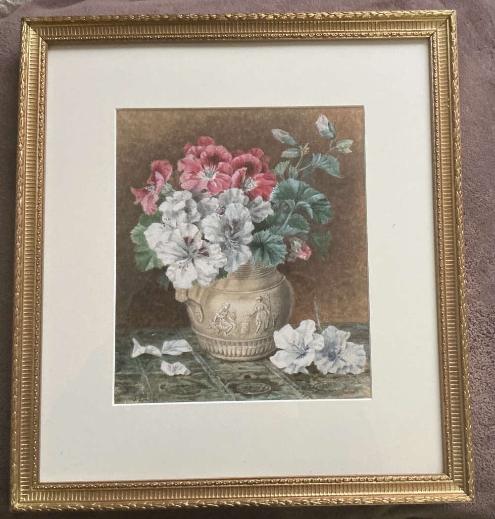 A Victorian still life watercolour painting depicting red and white pelargonium flowers arranged in a relief ceramic jug on a tiled surface. View II