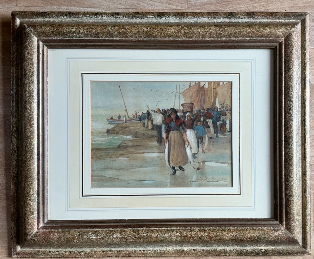 An Edwardian watercolour painting depicting fisherwomen and workers bringing in a catch along a rocky Yorkshire shore with fishing boats anchored in the background. View II