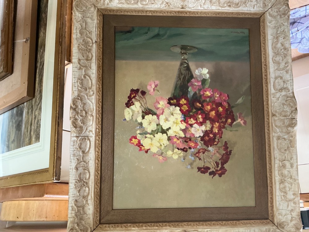 An oil painting depicting a bouquet of burgundy, pink, and cream polyanthus flowers arranged in a glass vase. View III